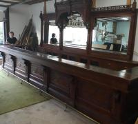  1E-AVAILABLE -  C. 1875  - GREAT CARVED  ANTIQUE BACK BAR  15  FT L  X 9 FT 6" H  AND MATCHING  20 FT   LONG  FRONT  BAR 
