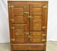 59A...OAK ICEBOX W/PORCELAIN INTERIOR AND BRASS HARDWARE...48