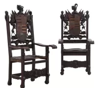 7A....Large pair of Continental figural carved walnut arm chairs with leather seats C 1880. Ht: 60" Wd: 29.25" Dpth: 26" Seat: 21"