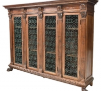 142.....WALNUT BOOKCASE WITH IRON DOOR PANELS...71.75 H X 97 W X 20.5 D