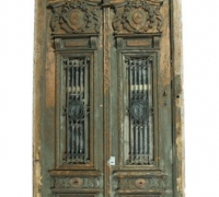 14F...A pair of relief carved entry doors in frame with iron inserts circa 1900. Doors: 112.75