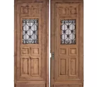 1N...One of two pair of French carved oak doors having raised panels and wrought iron sight panels circa 1880.   Each door has a width of 41". Ht: 109" Wd: 41"