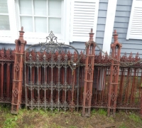1E..Circa 1880 ornate iron fence and gate in old red paint, gate embossed CHAMPION IRON FENCE CO. KENTON OHIO. Includes 6 posts at 4 ft 5 in high; 4 ft 2 in x 3 ft gate; and 6 sections - 10 ft 8 in; 10 ft; 11 ft 7 in; 10 ft 4 in; 9 ft 6 in; and 5 ft 5 in. Plus some hardware..60 ft total.