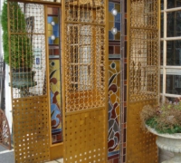 69- sold -great-antique-iron-and-stained-glass-elevator-with-iron-accordion-door-circa-1910