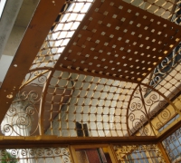 70- sold -great-antique-iron-and-stained-glass-elevator-with-iron-accordion-door-circa-1910