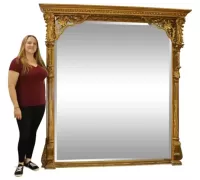 37..Carved gilt wood. Beveled glass. 78 1/4" h x 73 1/4" w x 11 1/2" d....